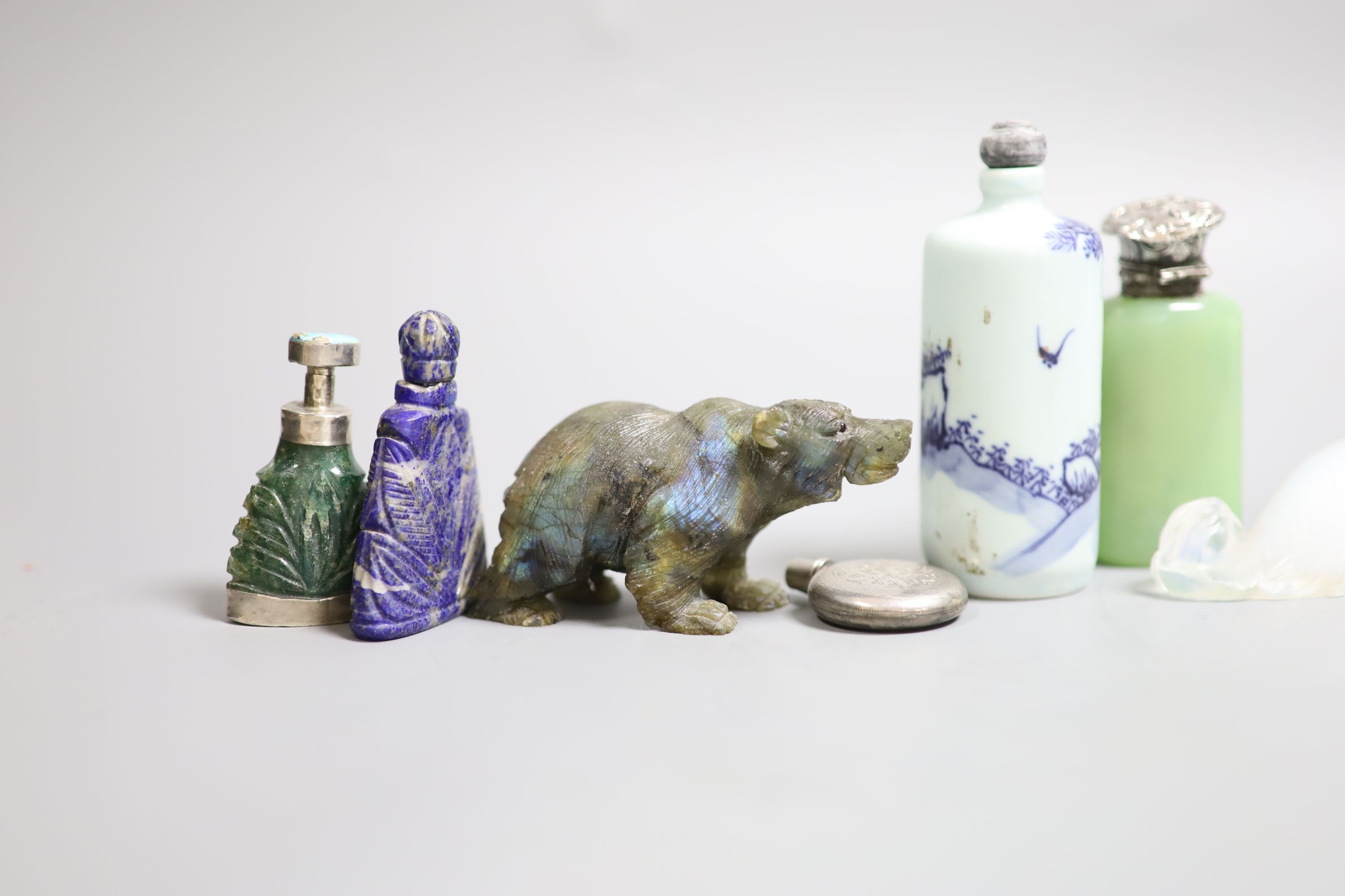 A collection of Chinese snuff bottles and European glass scent bottles, an opalescent glass figure of a dog etc.